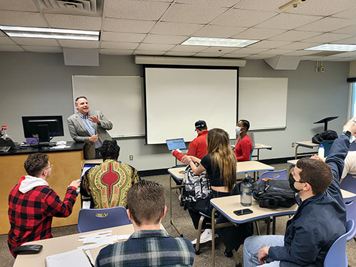 Professor Wilson in front of an accounting class.