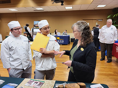 HCAT students talking to an employer at the HCAT Career Expo.