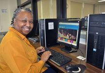 Andrena Nichols '17 sitting at a computer terminal.