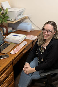 Karly Zepf at her desk in her home office. 