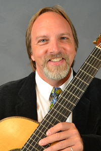 Sten Isachsen holding a guitar