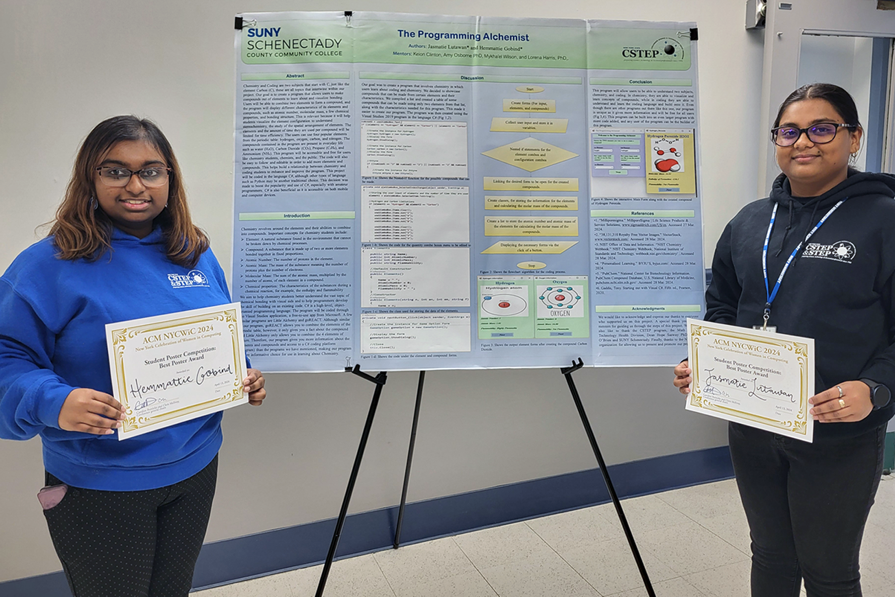 Hemmattie Gobind and Jasmatie Lutawan with the award-winning poster they created 