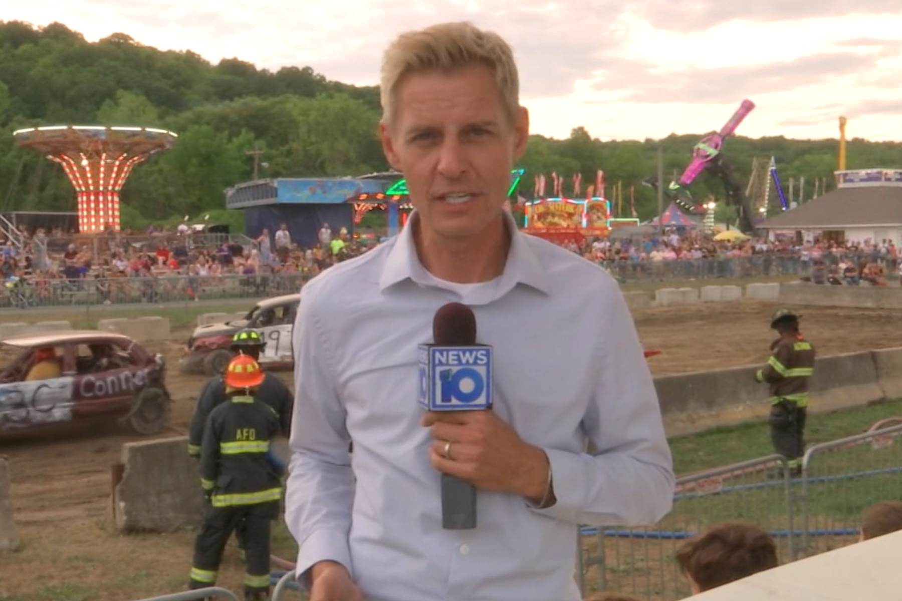 James De La Fuente holding NEWS10 microphone, conducting interview at Altamon Fair